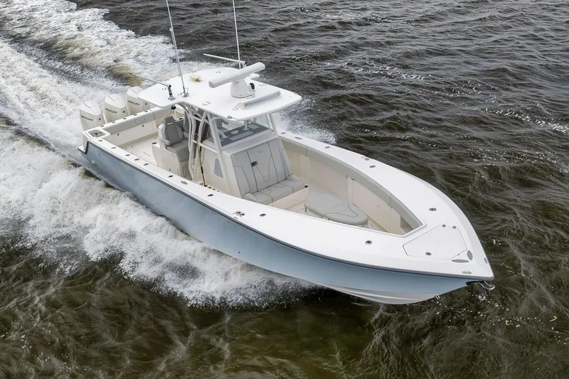 Slide: The Image of 2022 SeaVee 370Z boat cruising on water, showcasing sleek design and powerful engines. - 20