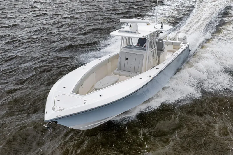 Slide: The Image of 2022 SeaVee 370Z boat cruising on open water, showcasing sleek design and performance. - 29