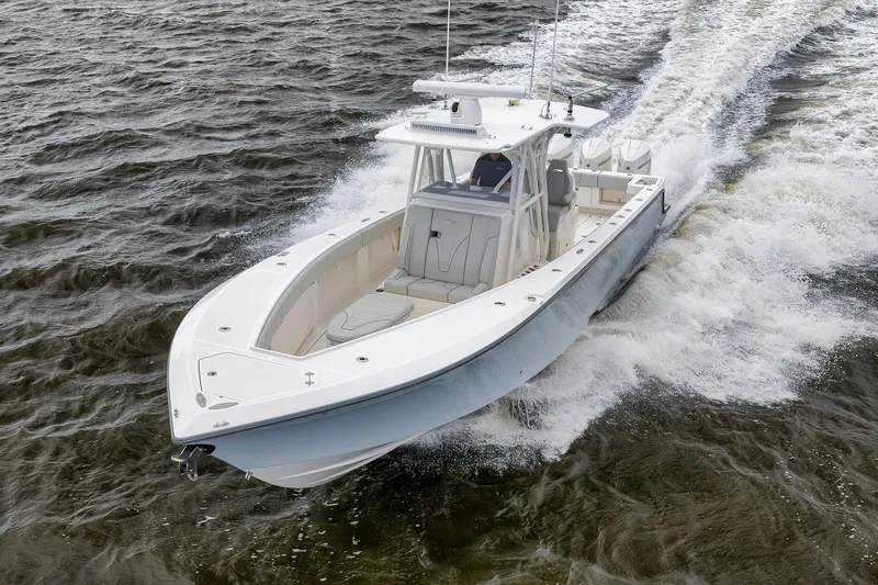 Slide: The Image of 2022 SeaVee 370Z boat cruising on open water, showcasing sleek design and performance. - 30