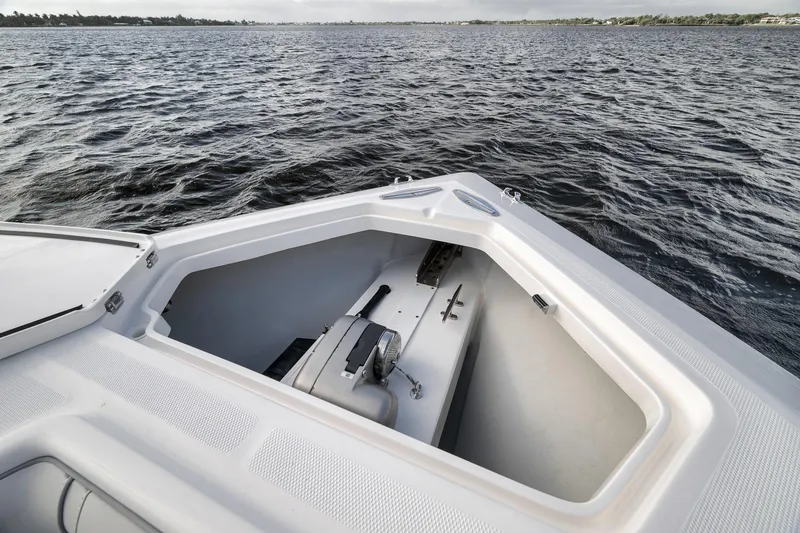 Slide: The Image of 2022 SeaVee 370Z boat bow storage compartment on open water. - 35