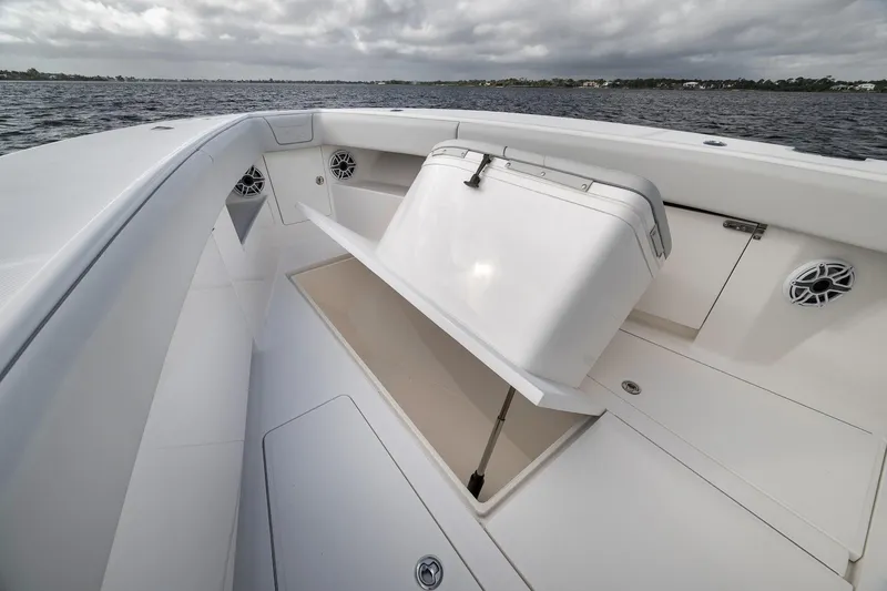 Slide: The Image of 2022 SeaVee 370Z boat interior with open storage compartment on a cloudy day. - 39