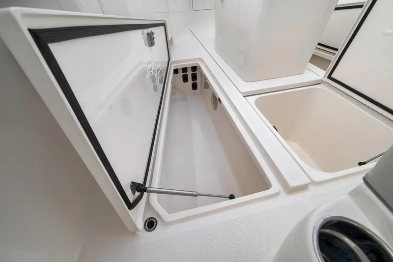 Slide: The Image of Open storage compartments on a 2022 SeaVee 370Z boat deck. - 43