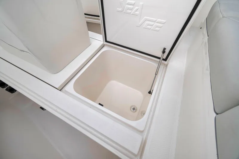 Slide: The Image of 2022 SeaVee 370Z boat storage compartment with open lid, showcasing interior space. - 44