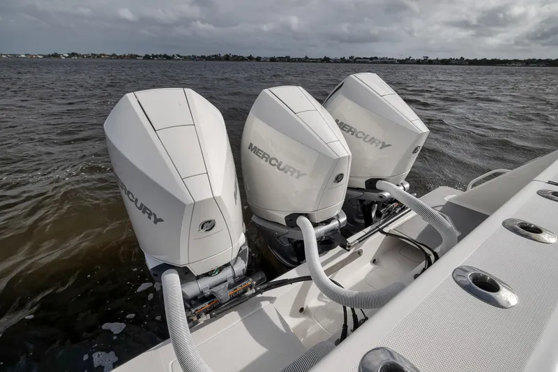 Slide: The Image of Triple Mercury outboard engines on a 2022 SeaVee 370Z boat in open water. - 48