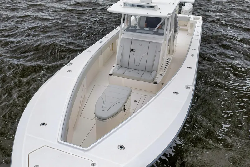 Slide: The Image of 2022 SeaVee 370Z boat on water, showcasing sleek design and spacious seating. - 5