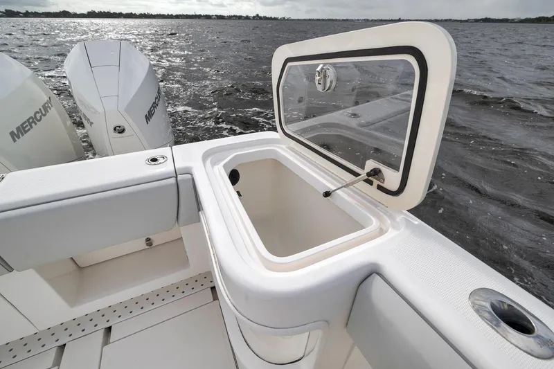 Slide: The Image of 2022 SeaVee 370Z boat with open storage compartment and Mercury engines on water. - 50