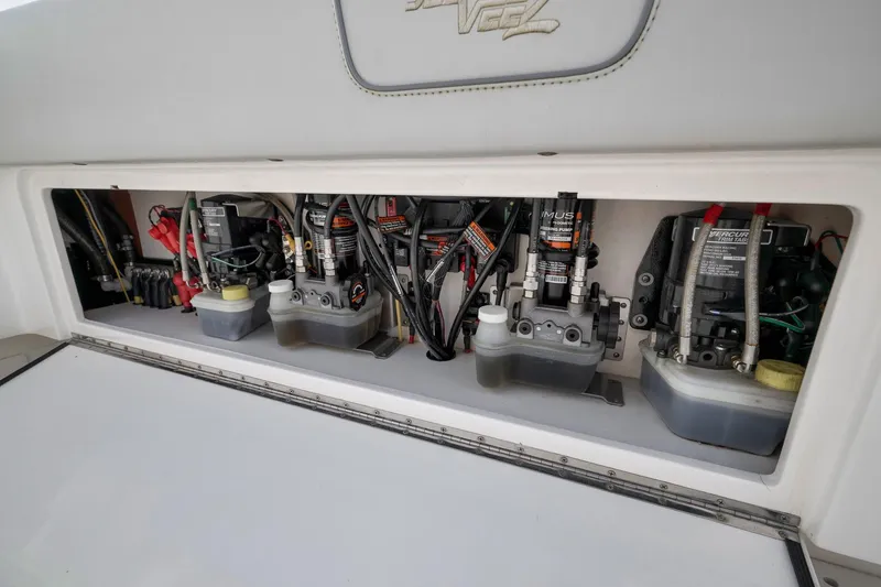 Slide: The Image of 2022 SeaVee 370Z boat engine compartment showcasing hydraulic and electrical systems. - 53