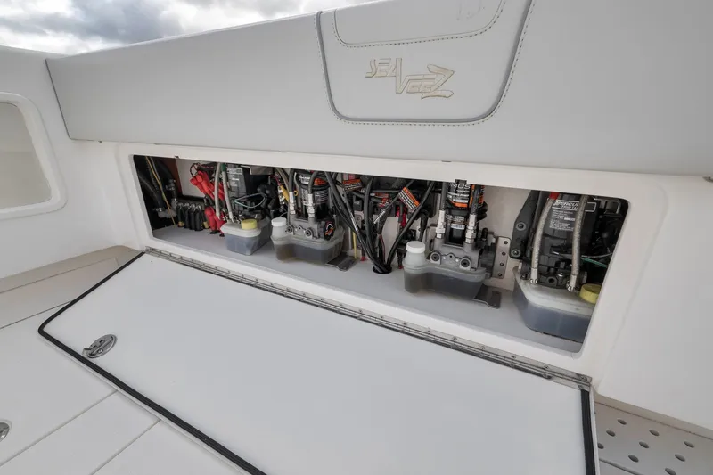 Slide: The Image of 2022 SeaVee 370Z boat engine compartment showcasing advanced mechanical components. - 54