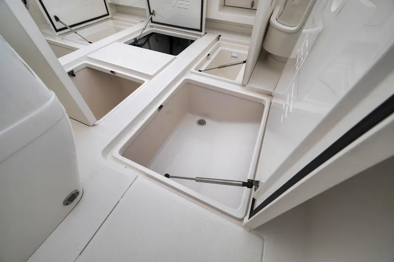 Slide: The Image of 2022 SeaVee 370Z boat storage compartments with open hatches, showcasing spacious interior design. - 57