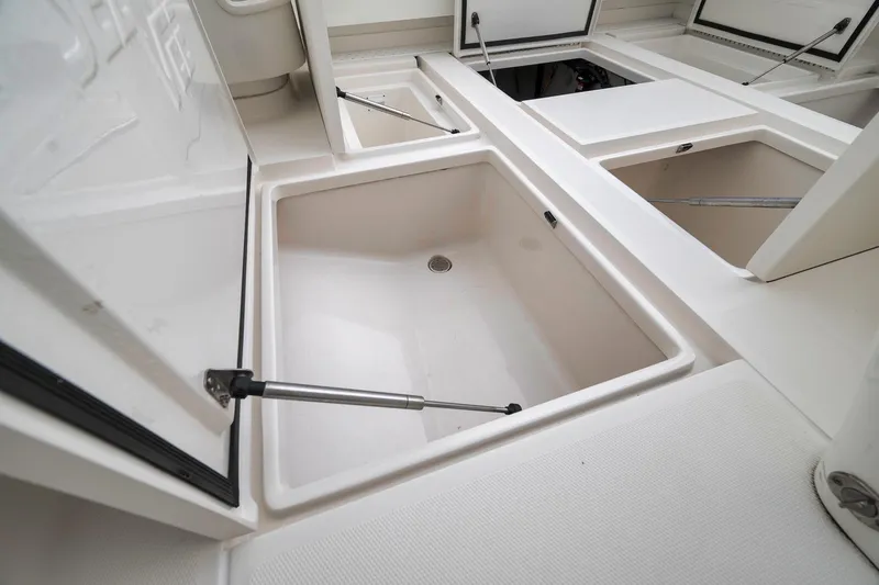 Slide: The Image of 2022 SeaVee 370Z boat storage compartments with open hatches, showcasing spacious interior. - 60