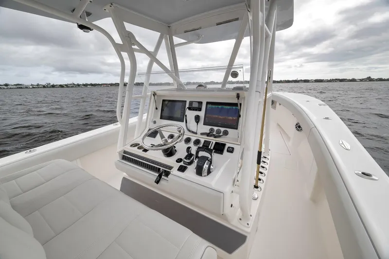Slide: The Image of 2022 SeaVee 370Z boat cockpit with modern controls and ocean view. - 64