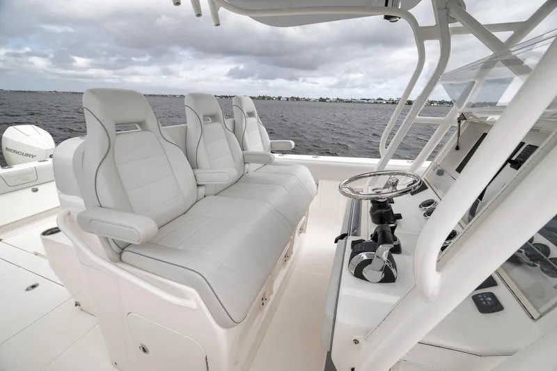 Slide: The Image of 2022 SeaVee 370Z boat interior with luxurious seating and modern helm controls. - 68