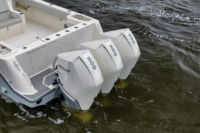 Slide: The Image of 2022 SeaVee 370Z boat with triple Mercury 300 engines on water. - 8