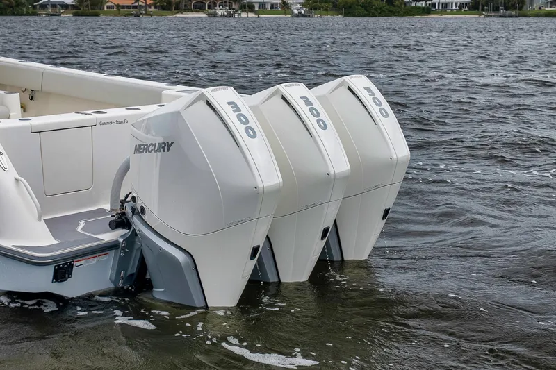 Slide: The Image of 2022 SeaVee 370Z boat with triple Mercury 300 outboard engines on water. - 9