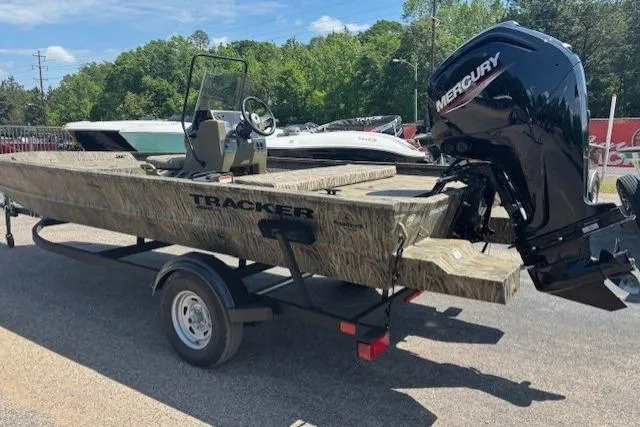 Slide: The Image of 2026 Tracker Grizzly 1860 CC boat with Mercury engine on trailer. - 2