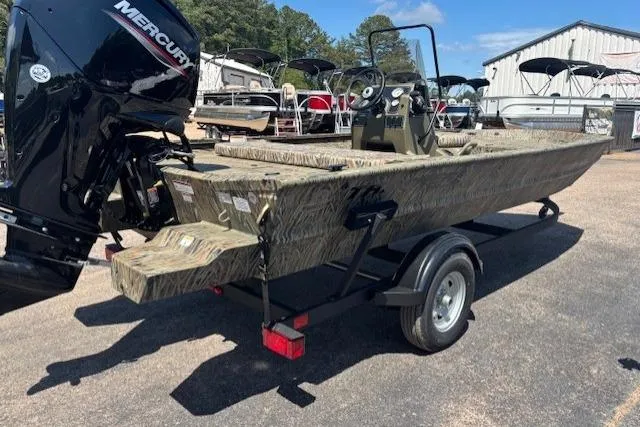 Slide: The Image of 2026 Tracker Grizzly 1860 CC boat on trailer with Mercury outboard motor. - 4