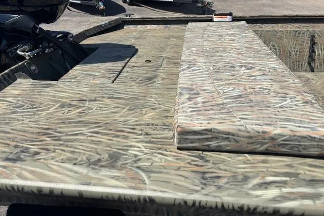 Slide: The Image of 2026 Tracker Grizzly 1860 CC boat with camouflage pattern deck. - 8