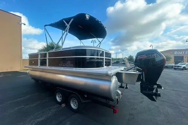 Slide: The Image of 2026 Sun Tracker Party Barge 20 DLX pontoon boat with canopy and outboard motor. - 3