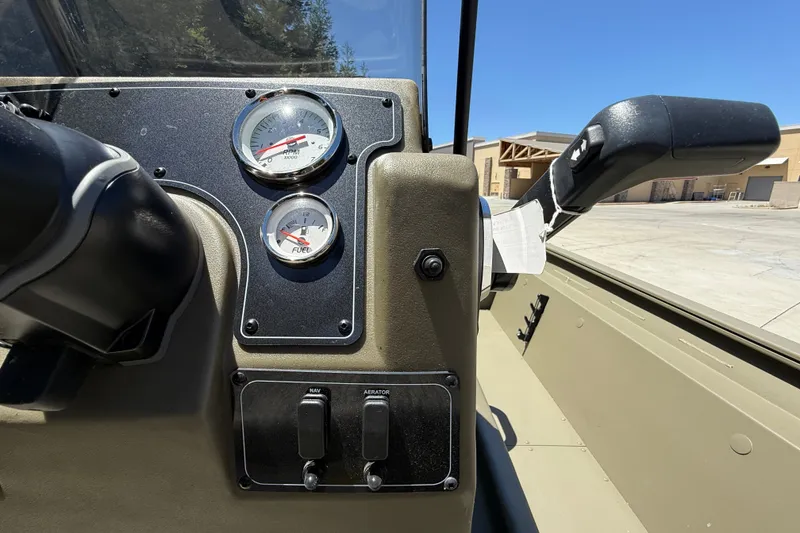 Slide: The Image of Dashboard of 2026 Tracker Grizzly 1860 CC boat with gauges and controls. - 24