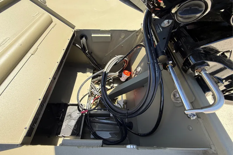 Slide: The Image of Interior view of 2026 Tracker Grizzly 1860 CC boat showing wiring and components. - 11