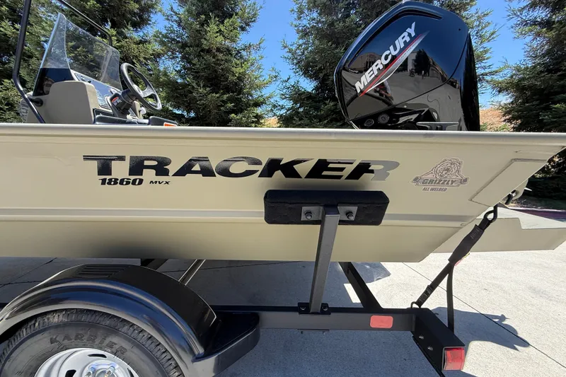 Slide: The Image of 2026 Tracker Grizzly 1860 CC boat with Mercury engine on trailer. - 8