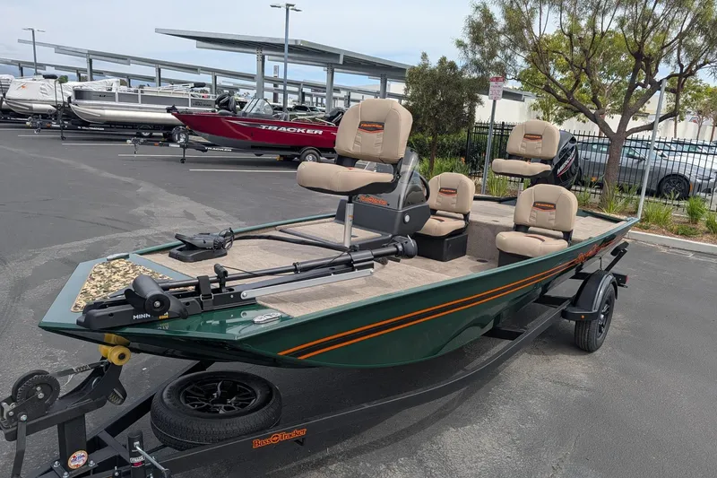 The Image of 2026 Tracker Bass Tracker Classic Limited boat on trailer, parked outdoors. - 0