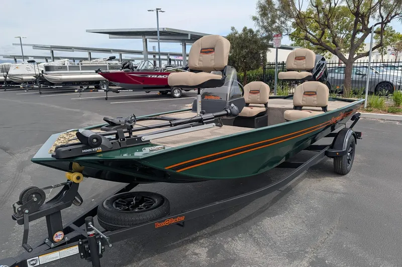 Slide: The Image of 2026 Tracker Bass Tracker Classic Limited boat on trailer in parking lot. - 3