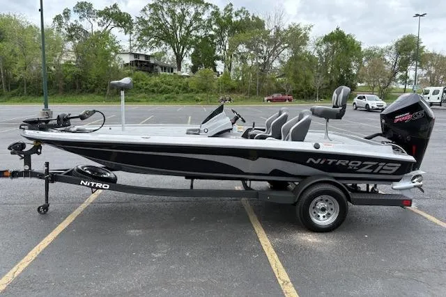 The Image of 2026 Nitro Z19 XL boat in parking lot, featuring sleek design and modern equipment. - 0
