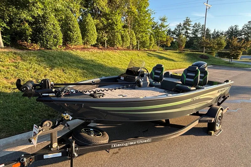 Slide: The Image of 2026 Ranger VS1782SC Angler boat on trailer, parked outdoors in sunny setting. - 3