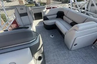 Slide: The Image of 2026 Sun Tracker SportFish 20 DLX pontoon boat interior with plush seating and modern design. - 3