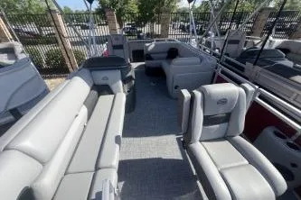 Slide: The Image of 2026 Sun Tracker SportFish 20 DLX pontoon boat with spacious seating and modern design. - 5