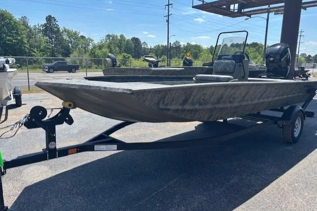The Image of 2026 Tracker Grizzly 1860 CC boat on trailer, parked outdoors. - 0