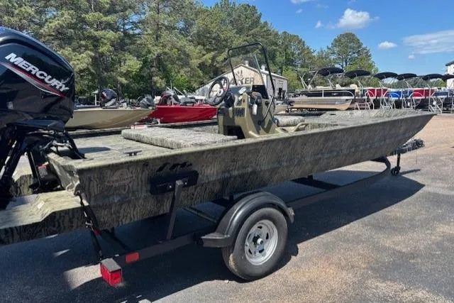 Slide: The Image of 2026 Tracker Grizzly 1860 CC boat on trailer, featuring a Mercury outboard motor. - 4