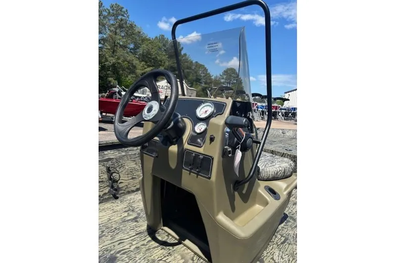 Slide: The Image of 2026 Tracker Grizzly 1860 CC boat console with steering wheel and gauges. - 9