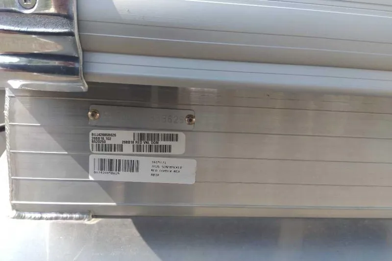 Slide: The Image of 2026 Sun Tracker Bass Buggy 18 DLX identification plate with barcodes and serial numbers. - 11
