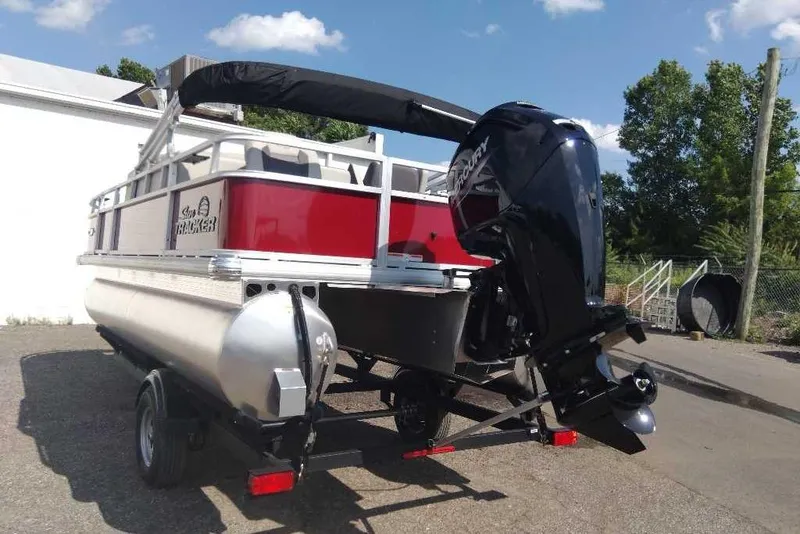 Slide: The Image of 2026 Sun Tracker Bass Buggy 18 DLX pontoon boat with Mercury outboard motor. - 7
