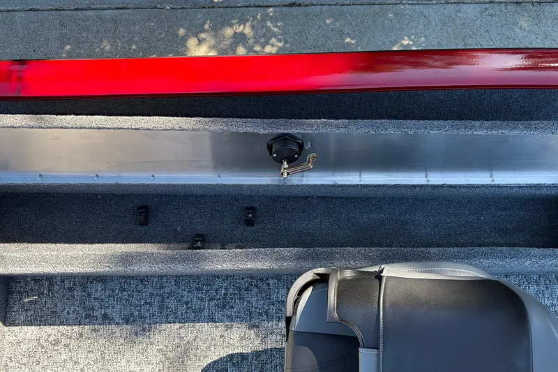 Slide: The Image of Interior view of 2026 Tracker Super Guide V-16 SC boat with carpeted flooring. - 24