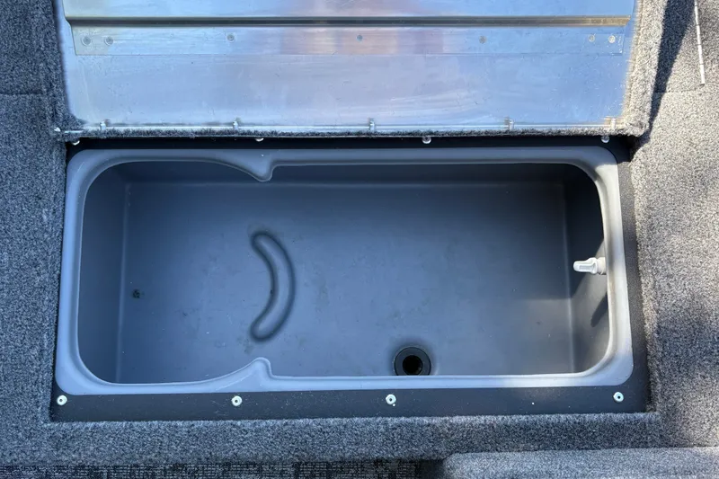 Slide: The Image of Open storage compartment in 2026 Tracker Super Guide V-16 SC boat. - 22