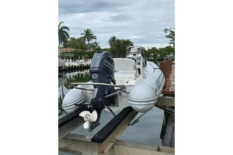 The Image of 2015 AB Inflatables Navigo 15 VS boat with Yamaha motor on a dock. - 1