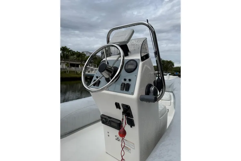 Slide: The Image of 2015 AB Inflatables Navigo 15 VS boat console with steering wheel and controls. - 5