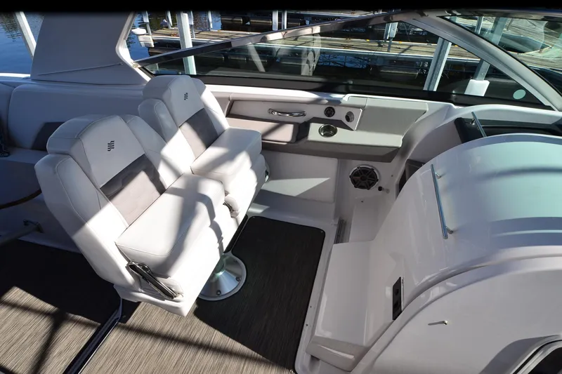 Slide: The Image of Interior of 2018 Four Winns H350 boat with luxurious seating and modern dashboard. - 15