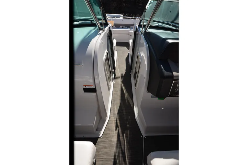 Slide: The Image of 2018 Four Winns H350 boat interior walkway with sleek design and modern features. - 22