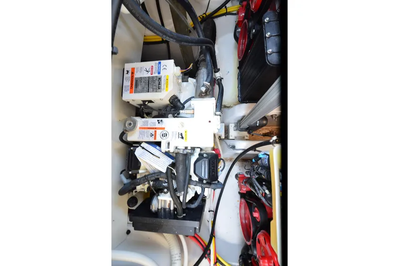 Slide: The Image of Engine compartment of 2018 Four Winns H350 boat, showcasing mechanical components and wiring. - 29