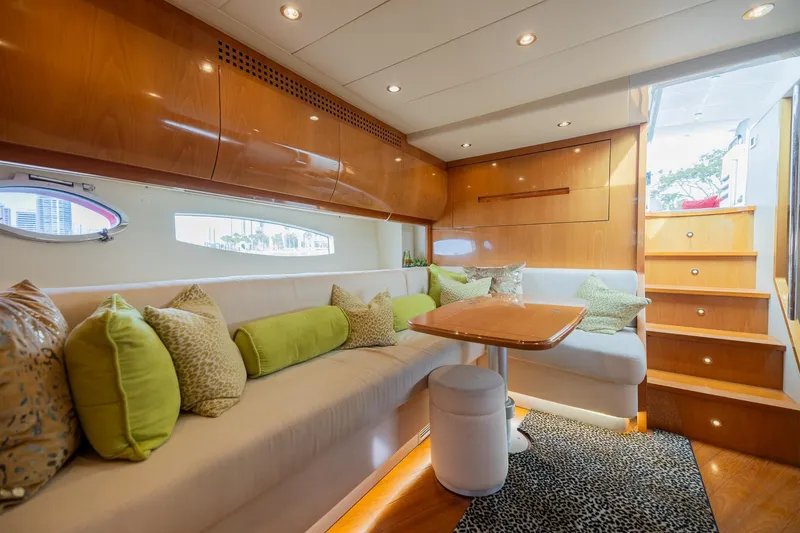 Slide: The Image of Luxurious interior of a 2007 Pershing 56 yacht with elegant seating and wooden finishes. - 17