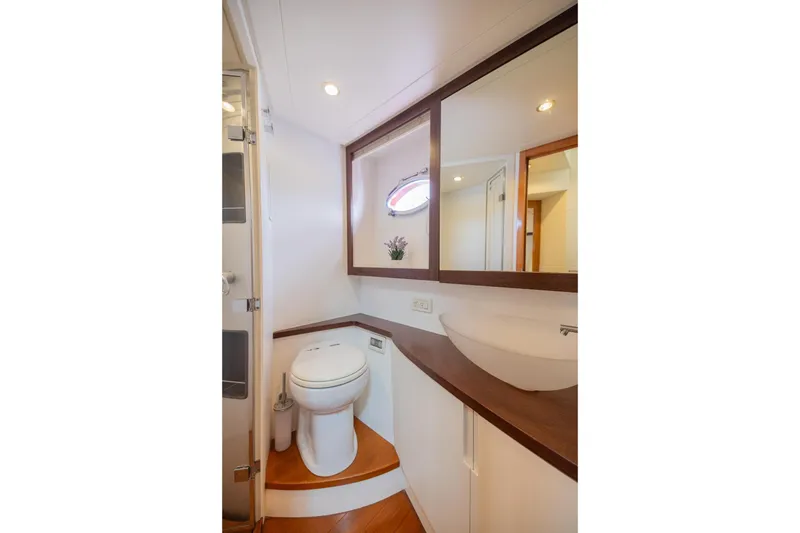 Slide: The Image of Luxurious bathroom on 2007 Pershing 56 yacht with modern fixtures and elegant design. - 19