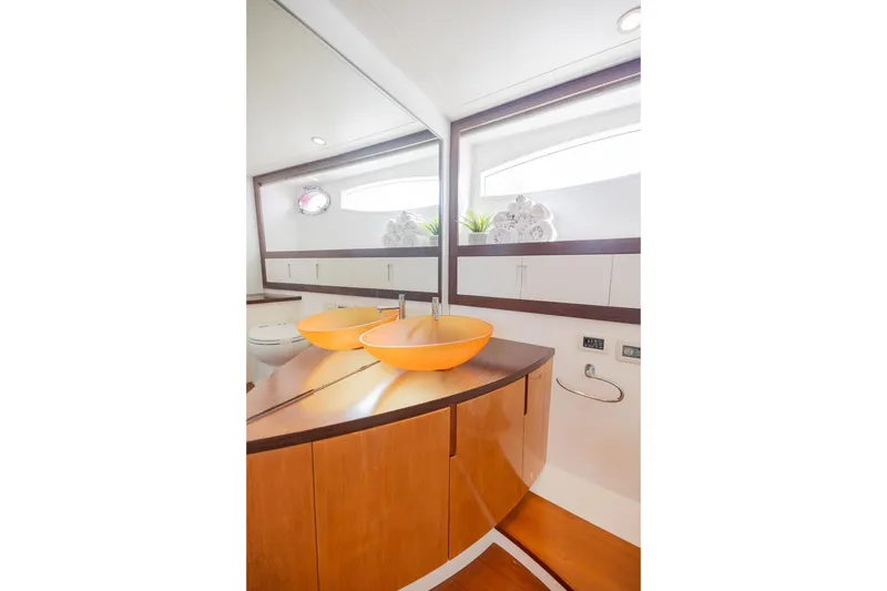 Slide: The Image of Luxurious bathroom interior of 2007 Pershing 56 yacht with modern orange vessel sinks. - 20