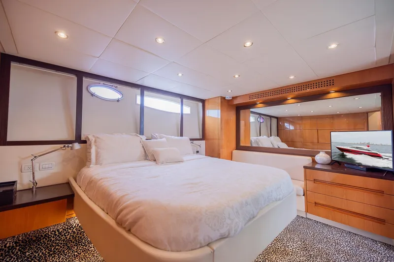 Slide: The Image of Luxurious bedroom interior of 2007 Pershing 56 yacht with modern decor and ambient lighting. - 22