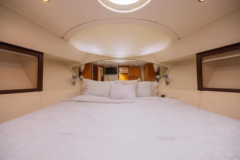 Slide: The Image of Luxurious bedroom interior of 2007 Pershing 56 yacht with elegant bedding and modern design. - 24