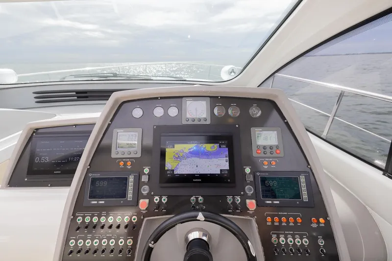 Slide: The Image of Cockpit of 2007 Pershing 56 yacht with advanced navigation and control systems. - 30