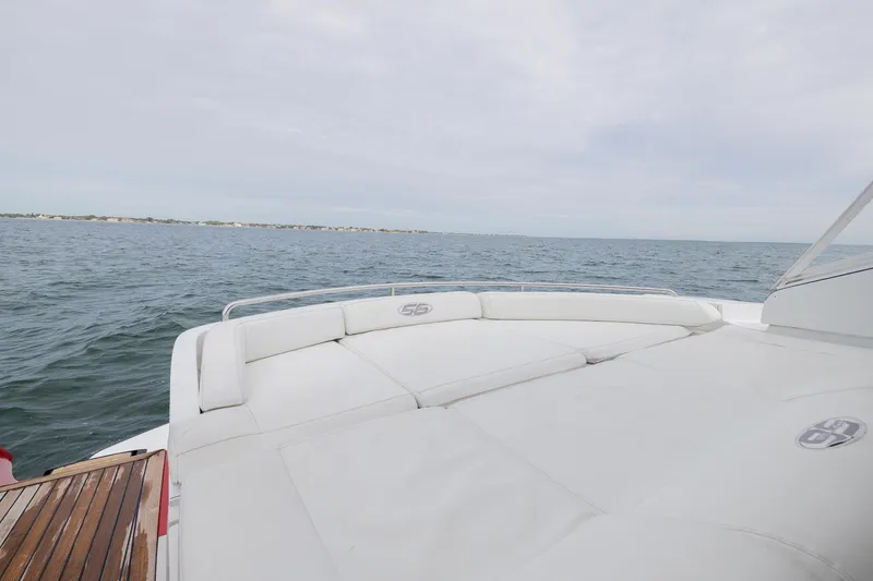 Slide: The Image of 2007 Pershing 56 yacht deck with ocean view and white seating. - 33